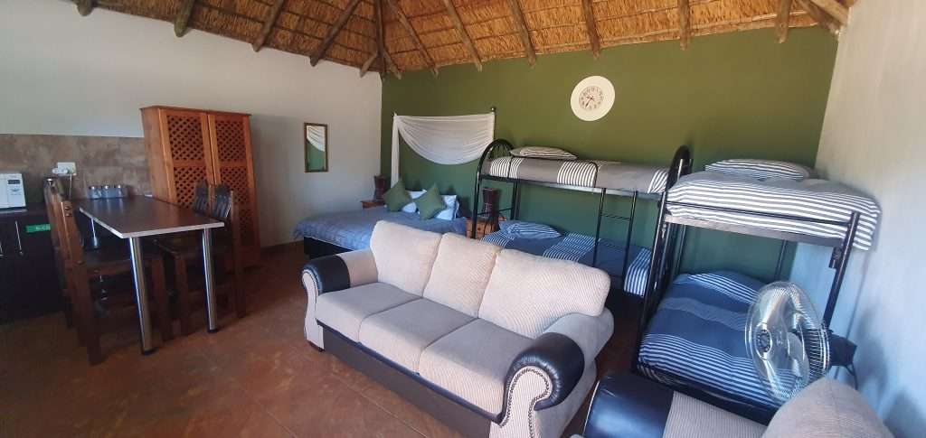 Open plan kitchen and sleeping area in the 6 Sleeper chalet at Tava Lingwe Game Lodge
