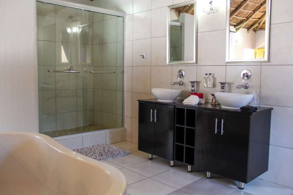 En-suite bathroom with double shower honeymoon suite Tava Lingwe